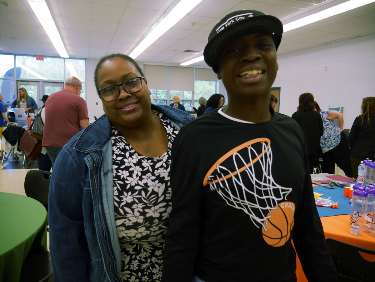 A mother and her teenage son at the Transition and Resource Fair at Spackenkill High School.