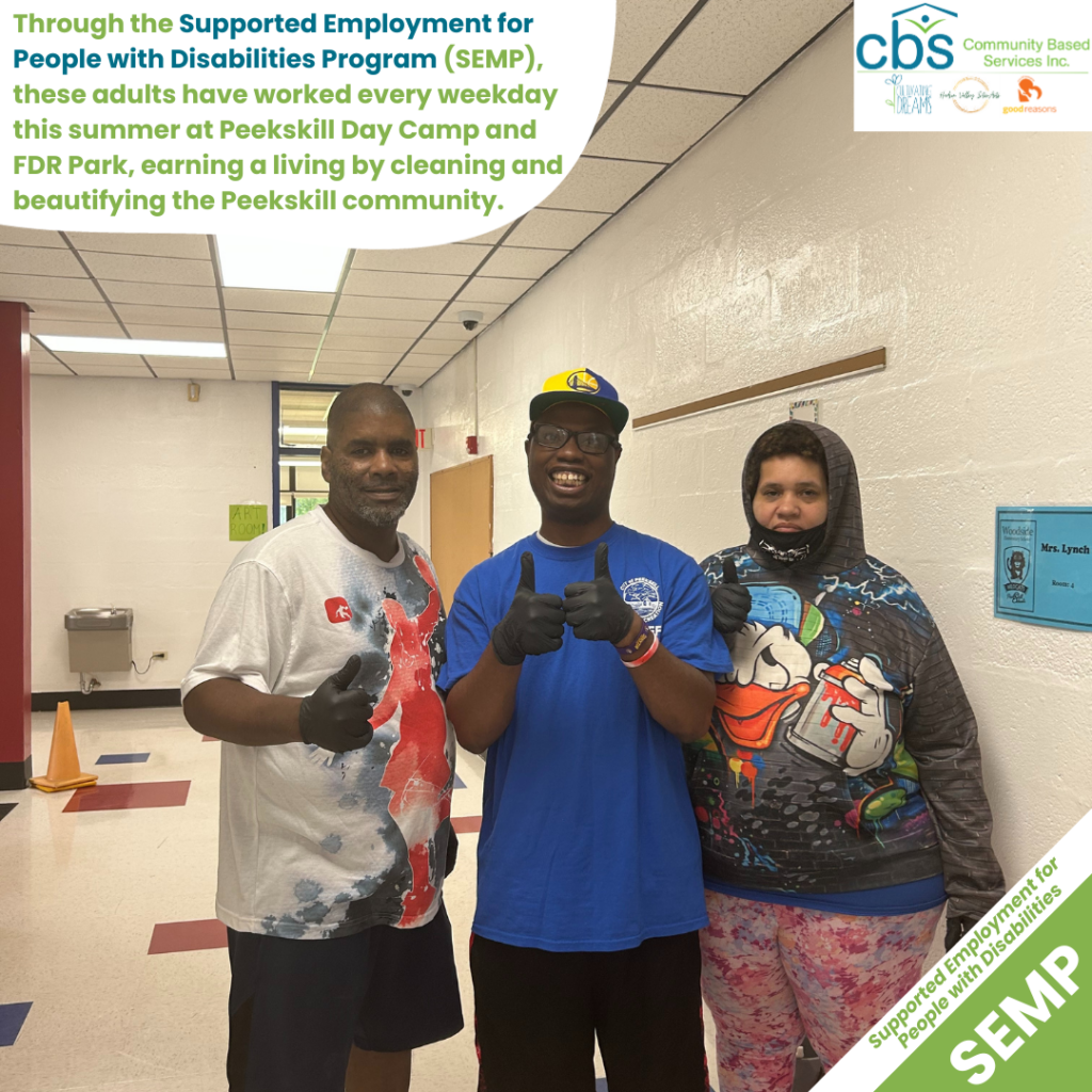 Three people in the supported employment program at CBS stand side by side with thumbs up at Peekskill Day Camp.