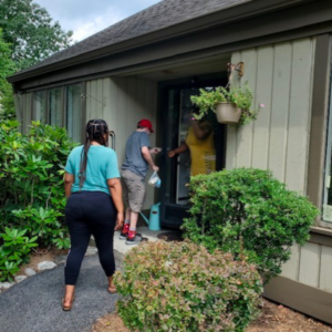 CBS friends, people with disabilities, deliver food to elderly through Meals on Wheels.