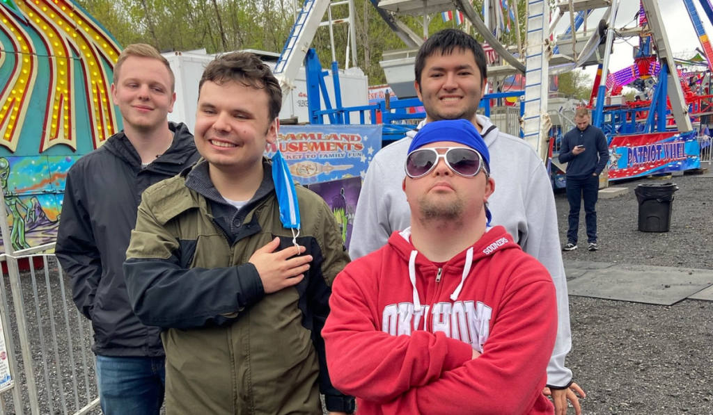 Young men in the CBS Respite Program enjoy an outing to a carnival.