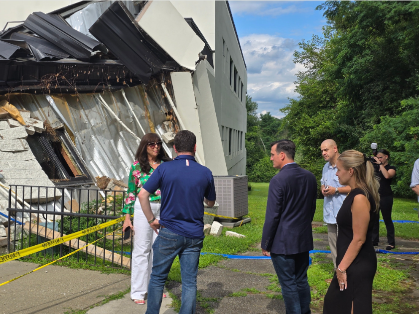 CBS CEO Dr. Vicki Sylvester stands with Congressman Mike Lawler and Putnam County Executive Kevin Byrne outside of the storm damaged building.
