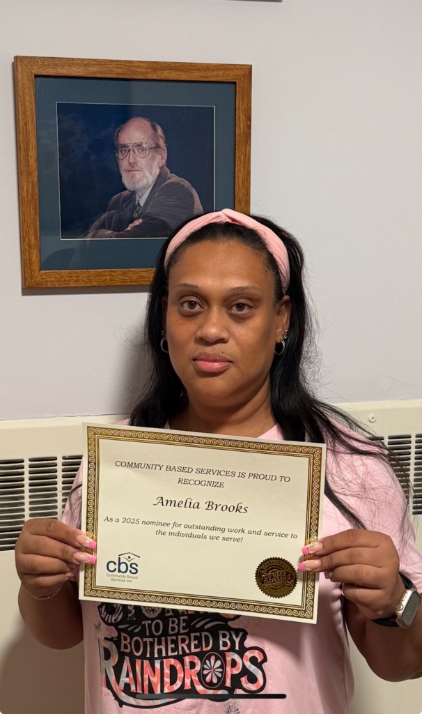 CBS DSP Amelia Brooks hold her certificate of recognition for being nominated to Employee of the Year 2025