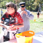 Participants play bobbing for apples