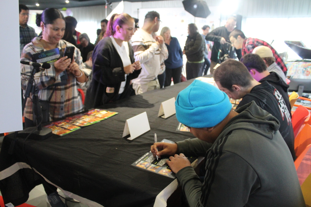 Fans line up to have their comic book signed