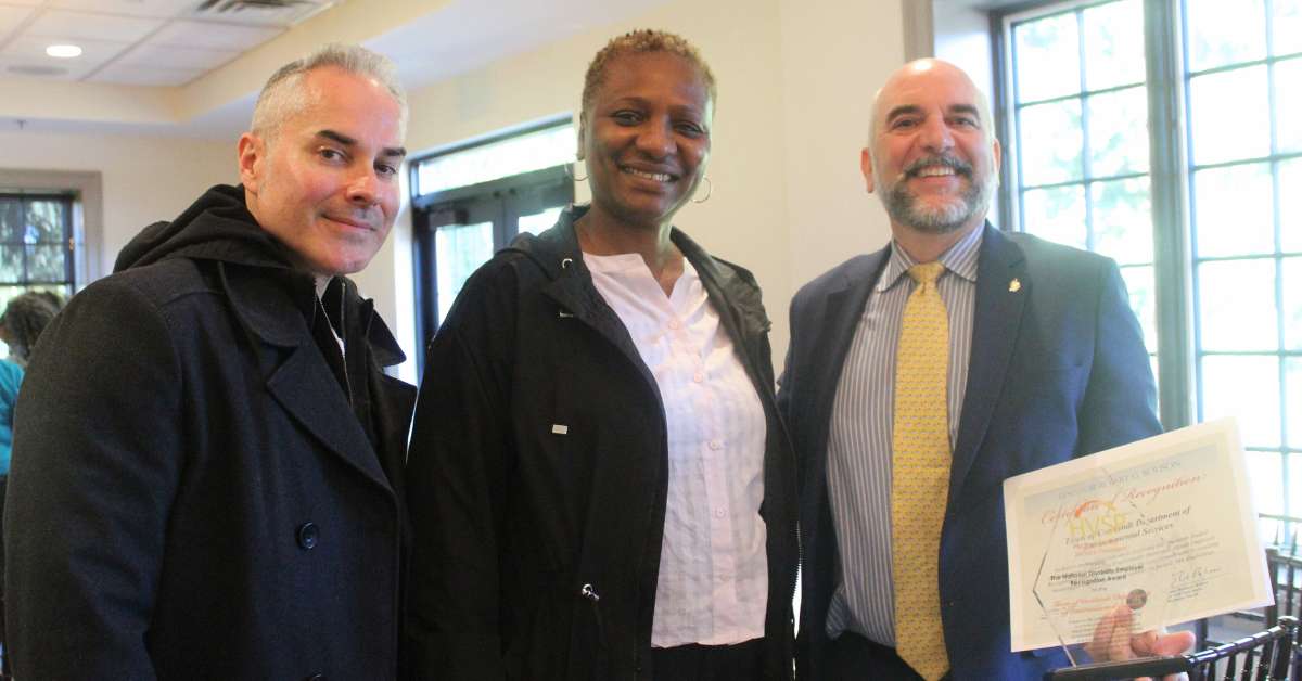 CBS Job Coach, Vocational Services Manager Kultumi Davies and James Creighton deputy town supervisor of Town of Cortland with his award and certificate in hand.