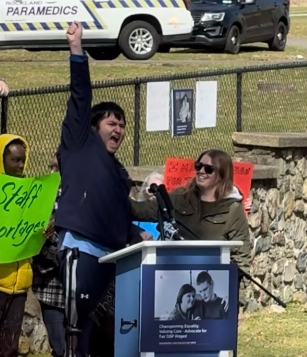 An empowering moment for a young man addressing the crowd about the importance of his direct support staff.