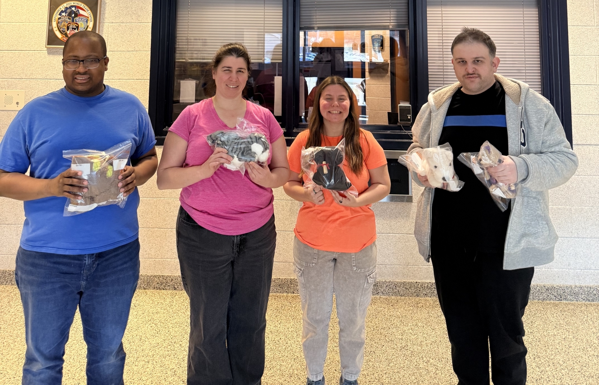 A CBS Day Hab group delivers refurbished stuffed animals to the Town of Fishkill Police Deptartment.