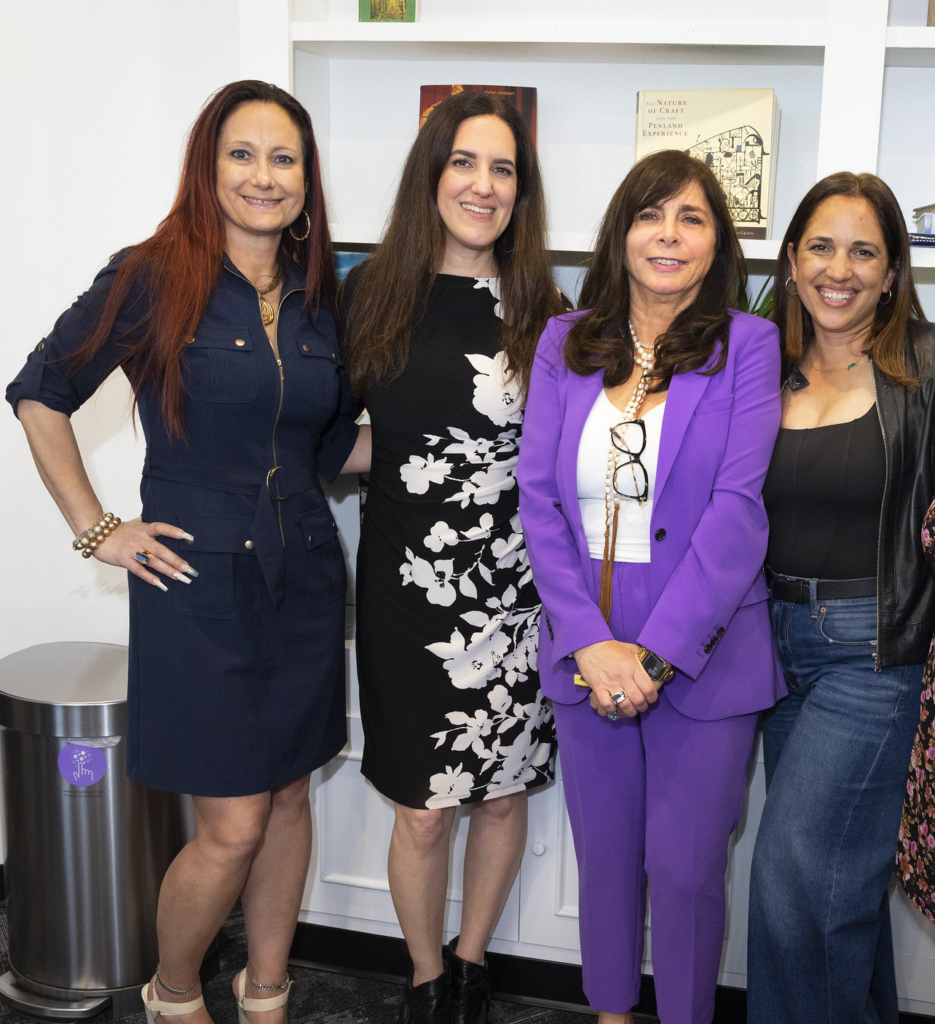 Director of Compliance Desiree Babich, Transition Coordinator Jennifer Havrilla, CEO Vicki Sylvester and Transition Coordinator Magda Piacentino pose during the anniversary celebration of InterArts in Patterson, NY.